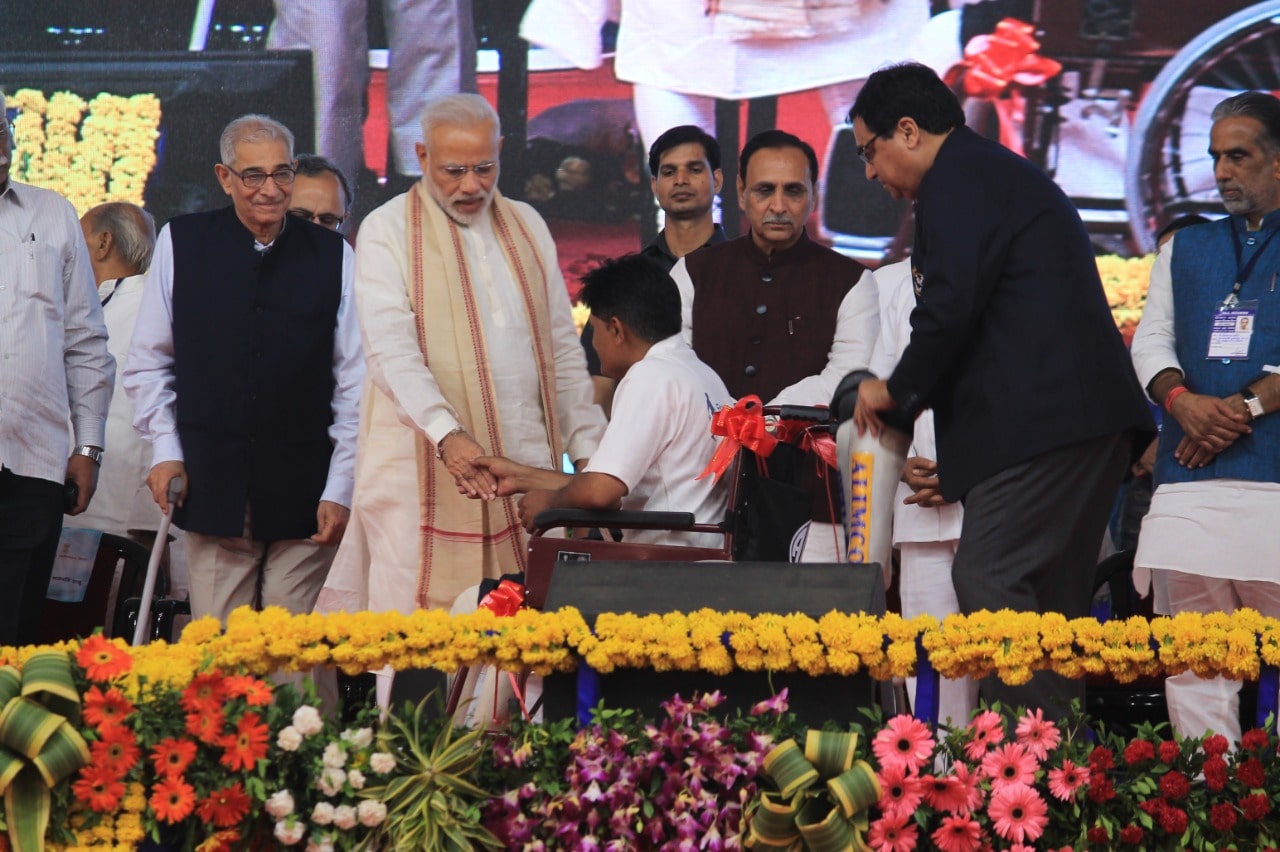 Hon'ble Prime Minister Shri Narendra Modi distributing Aids and Assistive Devices to Divyangjan under ADIP Scheme at 'Samajik Adhikarita Shivir' in Vadodara